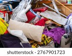 cluttered room with piles clothes and objects, chaotic interior, hoarding disorder concept, mess and overload, domestic space hoarding behavior and accumulation, lack organization mental overload