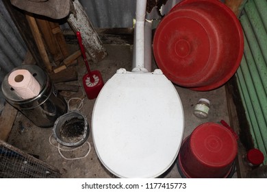 Cluttered Toilet And Bathroom Of Peace Corps Volunteer In Fiji.