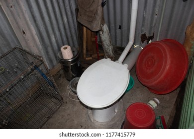 Cluttered Toilet And Bathroom Of Peace Corps Volunteer In Fiji.