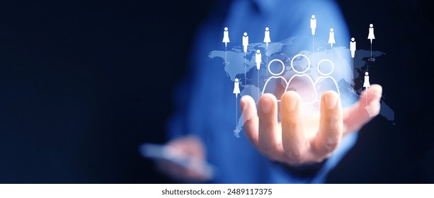 CMR, Customer Relationship Management concept. A man holds a virtual world map with customers data network technology. Control, develop, and manage relationship with business clients globally