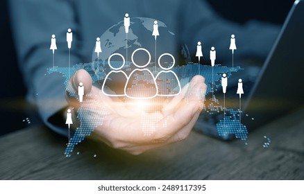 CMR, Customer Relationship Management concept. A man holds a virtual world map and globe with customers data network technology. Build and manage relationship with business clients globally - Powered by Shutterstock