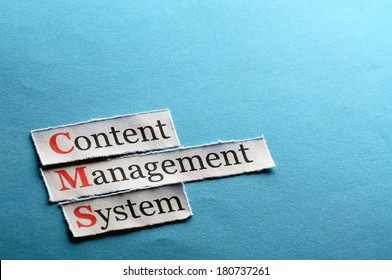CMS Content Management System abbreviation on blue paper