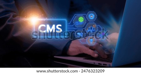 CMS, Content management system concept for business website management. Businessman showing glowing neon line of content management system icons on virtual screen.