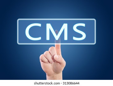 CMS - Content Management System - hand pressing button on interface with blue background.
