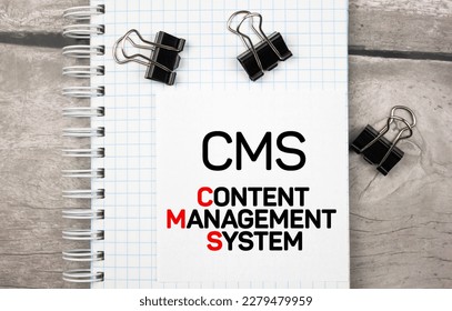 CMS CONTENT MANAGEMENT SYSTEMS inscription on notepad. CMS business concept - Shutterstock ID 2279479959
