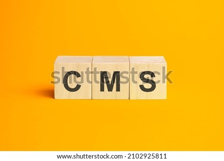 cms, questions and answers on wooden cubes. Concept