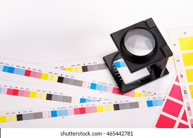 CMYK Color Scales And Loupe Used For Printing Process