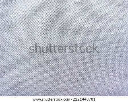 Cmyk halftone dot pattern on print paper as abstract background and graphic design element