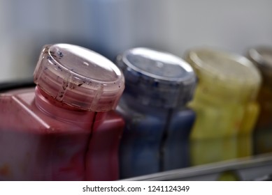 CMYK ink bottles from a sublimation printer
