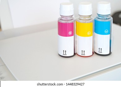 CMYK Ink cartridges for bulk ink printer. Cyan, Magenta and Yellow ink bottles. Inkjet printer refill. - Powered by Shutterstock