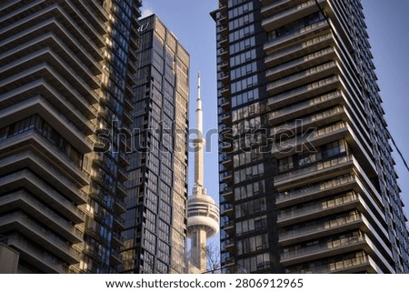 CN Tower Peeks Between Two Dark Glass Skyscrapers Toronto Canada