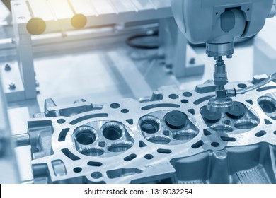 The CNC bore machine boring the intake and exhaust valve port at cylinder head .The engine part overhaul process by CNC machine.