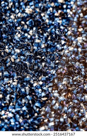 CNC Metalworkuíng. Chips, the texture and reflective surface create an intricate and visually striking pattern.