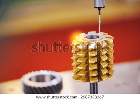 Cnc coordinate measuring machine inspecting gear precision, macro photo.