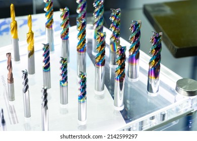 CNC cutters for metal. Multi-colored drills close-up. Accessories for engraving, milling, cutting of various metals. Cutters of different types. Monolithic milling tool. Solid carbide milling cutters