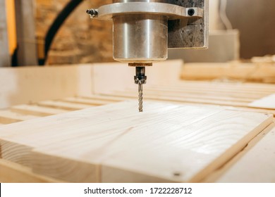 CNC Drilling Machine Is Machining Wood. Close-up