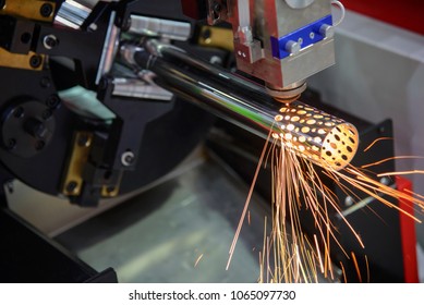 The CNC Fiber Laser Cutting Machine Cutting The Stainless Tube,pipe For Make Holes.