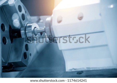 The CNC  grinder machine grinding inside the metal ring.Modern manufacturing process.