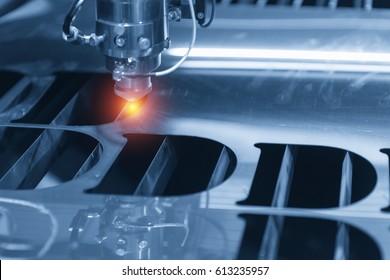 The CNC Laser Cut Machine While Cutting The Sheet Metal With The Sparking Light.The Hi-precision Sheet Cutting Process By Laser Cut