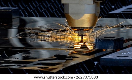 CNC laser cutting machine precision metal fabrication technology modern industry, High precision CNC laser cutting machine industrial metal sheet fabrication with spark.