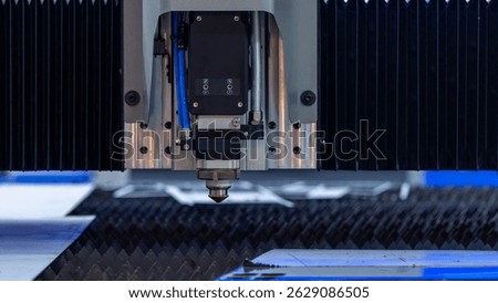 CNC laser cutting machine precision metal fabrication technology modern industry, High precision CNC laser cutting machine industrial metal sheet fabrication with spark.