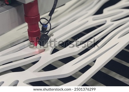 Cnc Laser cutting machine at work. Acrylic plastic cutting. Industry