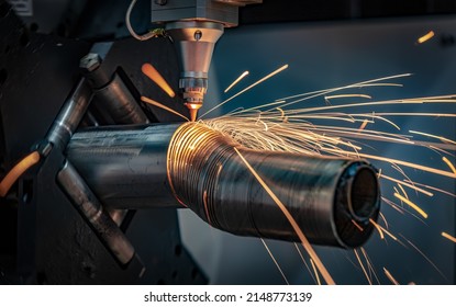 CNC Laser cutting of metal, modern industrial technology Making Industrial Details. The laser optics and CNC (computer numerical control) are used to direct the material or the laser beam generated. - Shutterstock ID 2148773139
