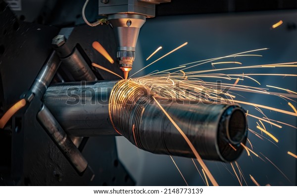 CNC Laser cutting of metal, modern industrial\
technology Making Industrial Details. The laser optics and CNC\
(computer numerical control) are used to direct the material or the\
laser beam generated.