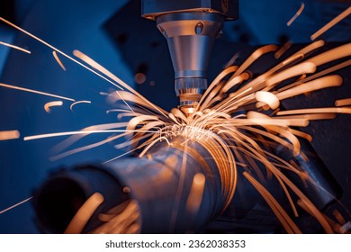 CNC Laser and gas cutting of metal, modern industrial technology Making Industrial Details. The laser optics and CNC are used to direct the material or the laser beam generated. - Powered by Shutterstock