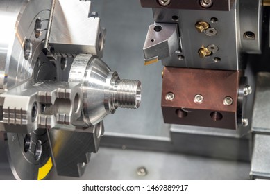 The CNC lathe machine cutting the thread at the cone shape parts. The metal working manufacturing process by turning machine. - Shutterstock ID 1469889917