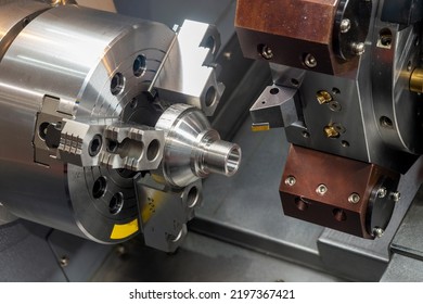 The  CNC lathe machine forming  cutting the metal shaft parts. The hi-technology metal working processing by CNC turning machine . - Shutterstock ID 2197367421
