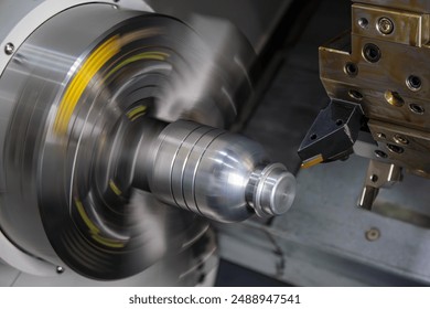 The  CNC lathe machine forming  cutting the metal shaft parts. The hi-technology metal working processing by CNC turning machine . - Powered by Shutterstock