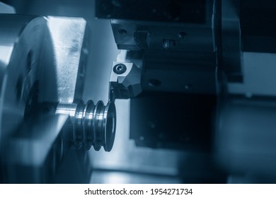 The  CNC Lathe Machine Groove Cutting The Pulley Parts. The Hi-technology Metal Working Processing By CNC Turning Machine .