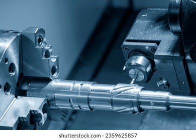 The CNC lathe machine slot milling the brass shaft parts by milling spindle. The high technology metal working with CNC turning machine. - Powered by Shutterstock