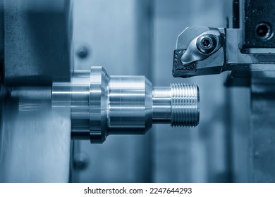 The CNC lathe machine thread cutting at the end of metal stud parts. The hi-technology metal working processing by CNC turning machine .