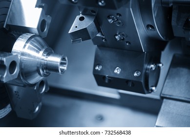 CNC lathe machine (Turning machine) cutting the metal  cone shape part .Hi-precision CNC machining concept.