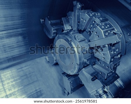CNC Machine Tool in Operation. Close-up view of a high-tech CNC machine tool turret. Ideal for illustrating advanced technology in industrial and engineering contexts.