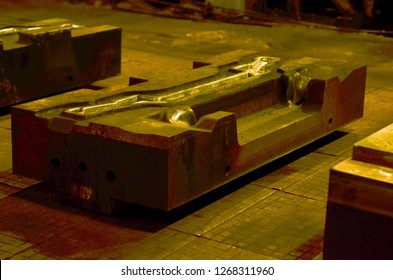 CNC Machinery In The Industrial Factory. Detail - Form Part Of A Cast Machine.  Sheet Metal Stamping Tool Die For Automotive Precision Parts.  Huge Forging Presses.