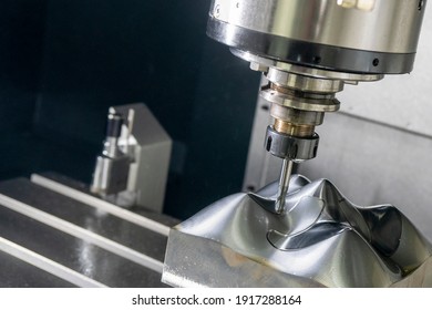 The  CNC  Milling Machine Cutting  The Mold Parts By Solid Ball  End-mill Tool. The Hi-precision Mold And Die Manufacturing Concept By Machining Center. 