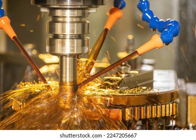 The CNC milling machine cutting the  mold parts with oil coolant method. The mold and die manufacturing process by CNC machining center. - Shutterstock ID 2247205667