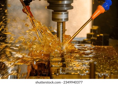 The CNC milling machine cutting the  mold parts with oil coolant method by indexable tools. The mold and die manufacturing process by CNC machining center. - Shutterstock ID 2349940377