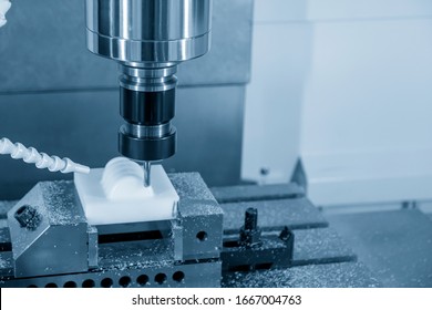 The CNC Milling Machine Cutting The Plastic Parts With Solid Ball Endmill Tool. The Hi-technology Manufacturing Processing By CNC Machining Center.