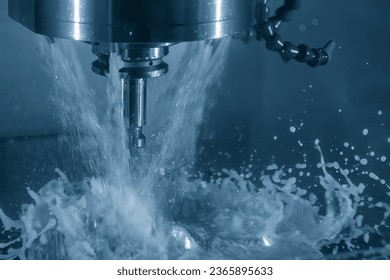 The CNC milling machine cutting the tire mold parts with oil coolant method. The mold and die manufacturing process by machining center with the solid ball endmill tools. - Shutterstock ID 2365895633