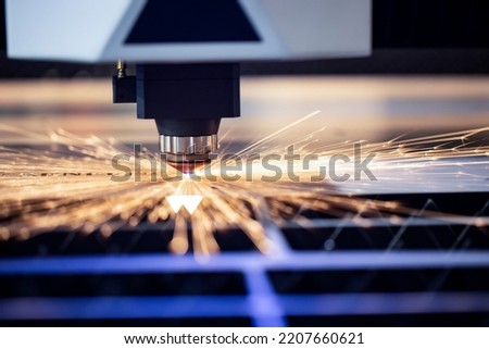Cnc milling machine. Processing and laser cutting for metal in the industrial. Motion blur. Industrial exhibition of machine tools.