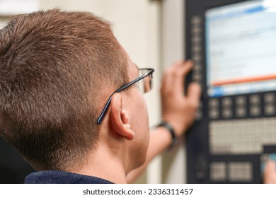 The CNC milling machine programmer makes adjustments to the program to change the cutting parameters.