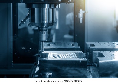 The CNC milling machine rough cutting the injection mold parts by indexable  endmill tools. The mold and die manufacturing process by machining center with the solid endmill tools. - Shutterstock ID 2058978089