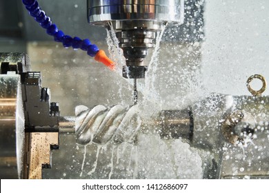 CNC milling machine work. Coolant and lubrication in gear metalwork industry - Shutterstock ID 1412686097