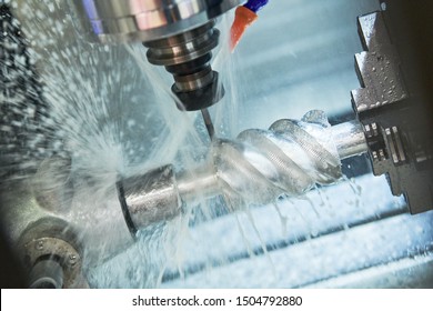 CNC milling machine work. Coolant and lubrication in metalwork industry - Shutterstock ID 1504792880