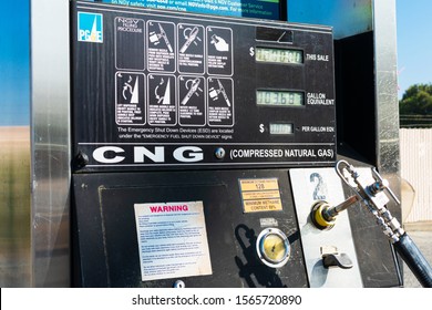 CNG, compressed natural gas, fueling station display with nozzle, lever and refueling procedure information for NGV vehicle - San Carlos, California, USA - 2019