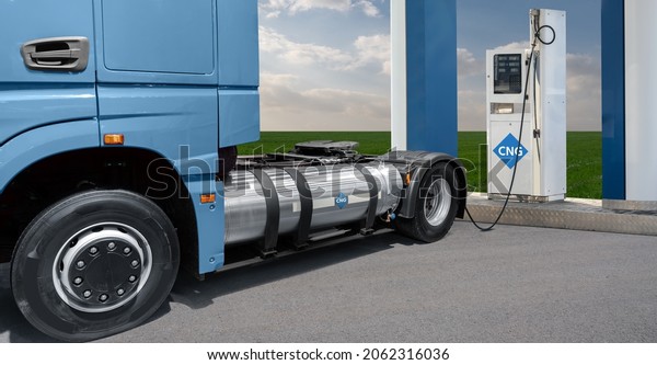 CNG truck at a gas\
station. Concept
